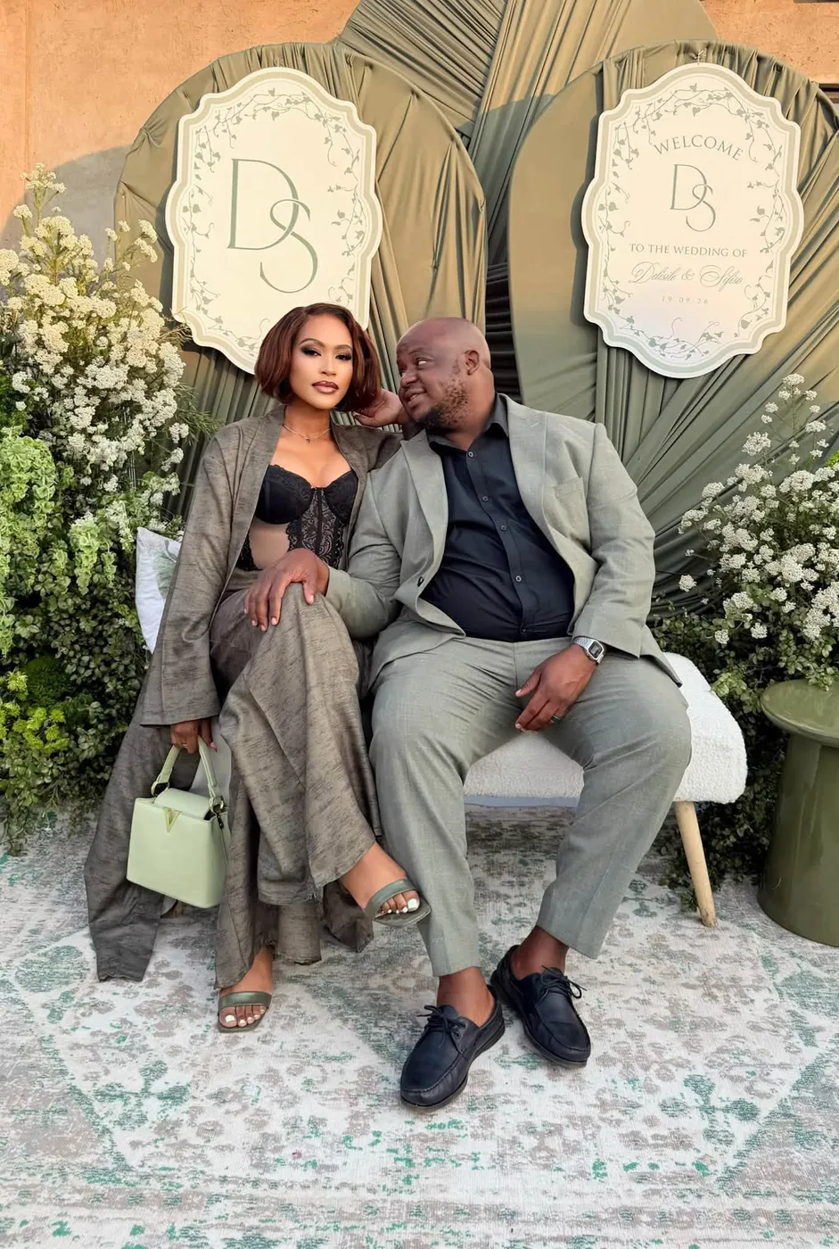 Oscar and his wife Thandeka seated together at an event
